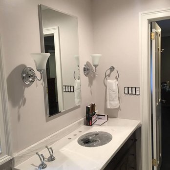 New Phase Contractors - a bathroom with a sink and mirror - General Contractors Near Me - Wantagh, New York New Phase Contractors - a bathroom with a sink and mirror - General Contractors Near Me - Wantagh, New York