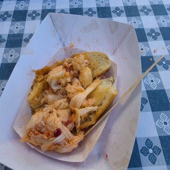 Roy Moore Lobster - The warm buttered lobster roll half eaten - Seafood Near Me - Rockport, Massachusetts Roy Moore Lobster - The warm buttered lobster roll half eaten - Seafood Near Me - Rockport, Massachusetts