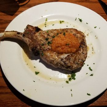 Blue Wolf Tavern - This pork chop is my absolute favorite meal and is always so satisfying. I'm never unhappy with this meal. Great portion size and price. - Italian Near Me - Boardman, Ohio