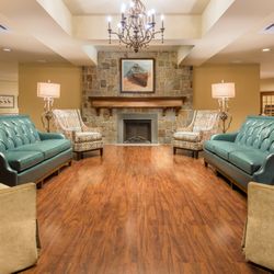 The Villa at Westhampton: A Willow Ridge Senior Living Community - Seating area with fireplace