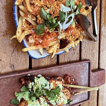 Cabra - Top: Salchipapas, Bottom: Chicken Thigh Anticucho - Peruvian Near Me - Chicago, Illinois Cabra - Top: Salchipapas, Bottom: Chicken Thigh Anticucho - Peruvian Near Me - Chicago, Illinois