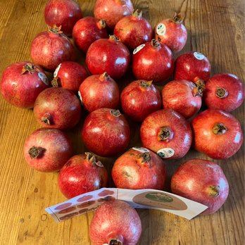 Rancho Tres Rios - a pile of pomegranates on a table - Farmers Market Near Me - Potrero, California Rancho Tres Rios - a pile of pomegranates on a table - Farmers Market Near Me - Potrero, California