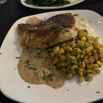 Islands Fish Grill - This is a jerk snapper, served over a creamy dill sauce with chimichurri corn and grits. Make reservations, though, as this is no secret. - Seafood Near Me - Indialantic, Florida