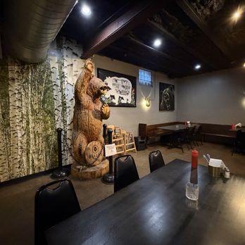 Oskar's Slider Bar - Giant carved bear at the back of the restaurant - Bars Near Me - Louisville, Kentucky Oskar's Slider Bar - Giant carved bear at the back of the restaurant - Bars Near Me - Louisville, Kentucky