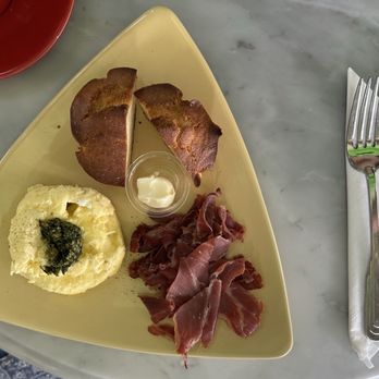 Raintree Bakery Coffeehouse - Eggs with macadamia nut pesto, prosciutto, and a butter muffin. - Bakeries Near Me - Honolulu, Hawaii Raintree Bakery Coffeehouse - Eggs with macadamia nut pesto, prosciutto, and a butter muffin. - Bakeries Near Me - Honolulu, Hawaii