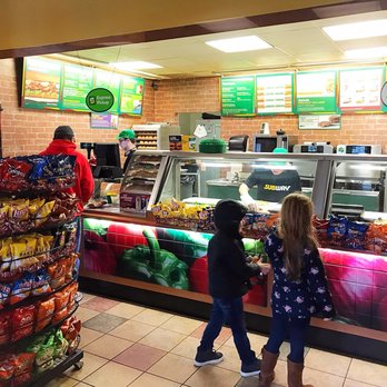 Subway - a couple of people standing in front of a counter - Sandwiches Near Me - Santa Claus, Indiana Subway - a couple of people standing in front of a counter - Sandwiches Near Me - Santa Claus, Indiana