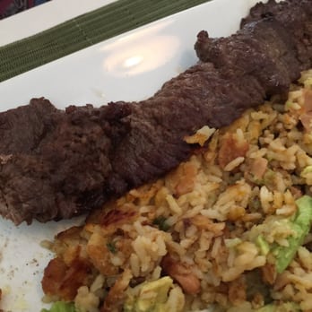 Costa Verde - Lomo salteado.  The rice with avocado is sublime - and the skirt is perfectly grilled. - Peruvian Near Me - Naples, Florida