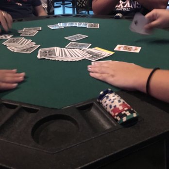 Time Well Wasted Entertainment - people playing cards on a table - Party & Event Planning Near Me - Houston, Texas Time Well Wasted Entertainment - people playing cards on a table - Party & Event Planning Near Me - Houston, Texas