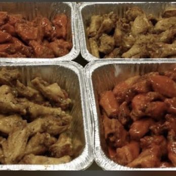 Wing kitchen - four containers of chicken wings and carrots - Chicken Wings Near Me - Tuscaloosa, Alabama Wing kitchen - four containers of chicken wings and carrots - Chicken Wings Near Me - Tuscaloosa, Alabama