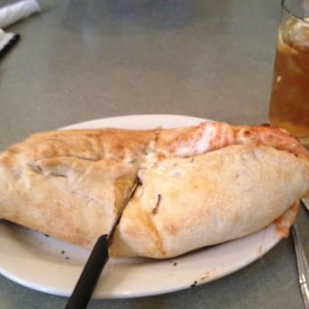 Rockefeller's Grille - Italian Calzone - w/ cappicola, salami, pepperoni, tomato sauce, onions and cheese. - American Near Me - McKees Rocks, Pennsylvania Rockefeller's Grille - Italian Calzone - w/ cappicola, salami, pepperoni, tomato sauce, onions and cheese. - American Near Me - McKees Rocks, Pennsylvania