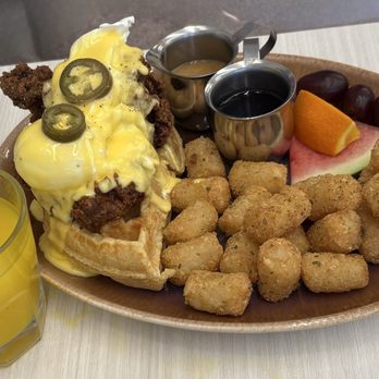 Yolks - Bloor West - Fried chicken eggs Benedict with tator tots. - Breakfast & Brunch Near Me - Toronto, Ontario Yolks - Bloor West - Fried chicken eggs Benedict with tator tots. - Breakfast & Brunch Near Me - Toronto, Ontario