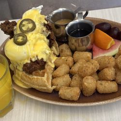 Fried chicken eggs Benedict with tator tots.
