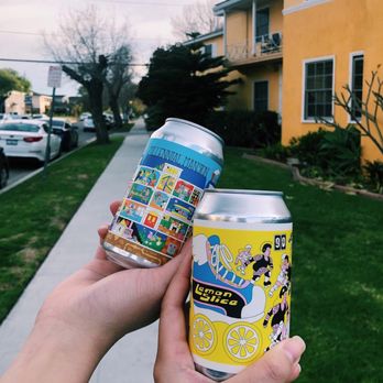 Stateside Crafts - two cans of beer in front of a house - Specialty Food Near Me - Long Beach, California