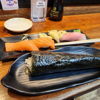 Geta - Salmon nigiri, hamachi and a spicy tuna handroll. - Japanese Near Me - Oakland, California Geta - Salmon nigiri, hamachi and a spicy tuna handroll. - Japanese Near Me - Oakland, California