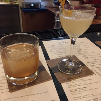Spoke & Steele - Rough Rider -- bourbon, bacon syrup, cinnamon, and smoked paprika.Dotty Henchman  right w/ gin , ginger syrup and peach liquor - American Near Me - Indianapolis, Indiana