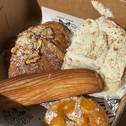 Almond croissant, cinnamon roll, kumquat torta de azucar, birria croissant Almond croissant, cinnamon roll, kumquat torta de azucar, birria croissant