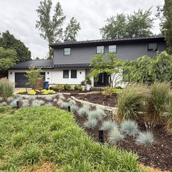 Greenheart Buildings - Full exterior remodel plus landscaping. Exterior rigid insulation & siding, Marvin windows & door, garage door, new decking & metal roof.