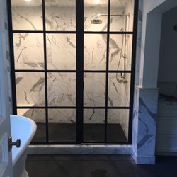 Coastal Glass and Mirror - Custom Fully Framed Panel and Door with dividers from floor to ceiling.