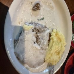 Chicken fried steak, seems to be missing side, bread and onion rings as they don't make the plate like the used to.