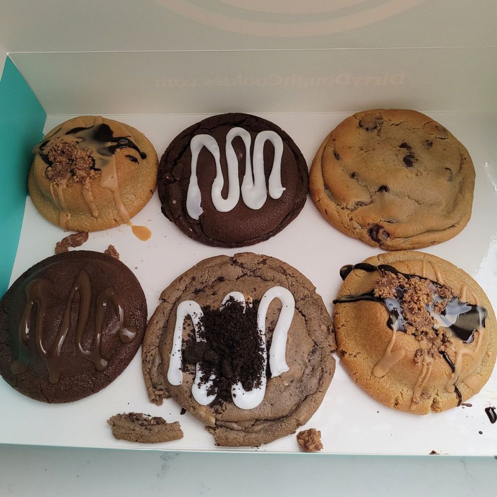 a box of doughnuts with frosting