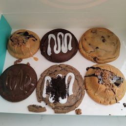 a box of doughnuts with frosting