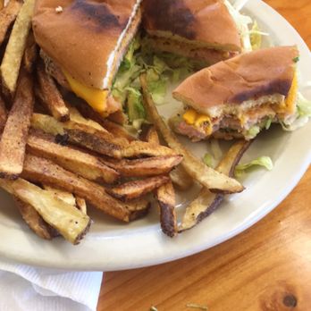 El Jacalito - Shrimp Burger with cheddar cheese, avocado, shredded lettuce and onion on a toasted bun, served with a bed of fresh cut seasoned fries. - Mexican Near Me - Las Cruces, New Mexico El Jacalito - Shrimp Burger with cheddar cheese, avocado, shredded lettuce and onion on a toasted bun, served with a bed of fresh cut seasoned fries. - Mexican Near Me - Las Cruces, New Mexico