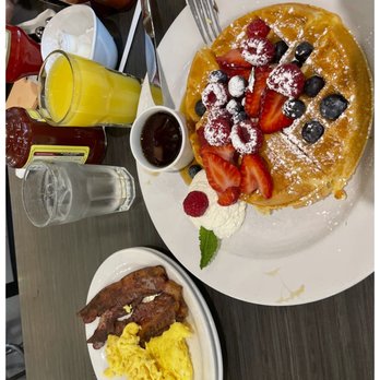 Chicago Waffles - Original Belgian Waffle (with added berries), a side of eggs, and a side of crispy bacon - Breakfast & Brunch Near Me - Chicago, Illinois