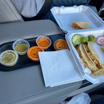 Tacos El Tio - two trays of food on a car seat - Food Trucks Near Me - Christiansburg, Virginia Tacos El Tio - two trays of food on a car seat - Food Trucks Near Me - Christiansburg, Virginia
