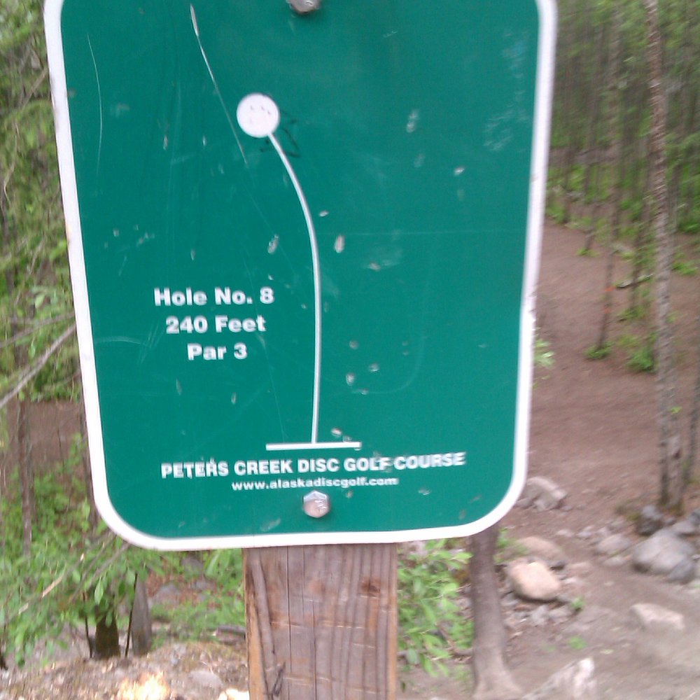 Peters Creek Disc Golf Course - Sign for hole #8 - Disc Golf Near Me - Chugiak, Alaska Peters Creek Disc Golf Course - Sign for hole #8 - Disc Golf Near Me - Chugiak, Alaska