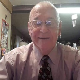 a man wearing glasses and a tie a man wearing glasses and a tie