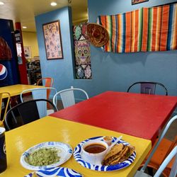 Las Palmitas - Cute decor and a huge plate of guacamole.