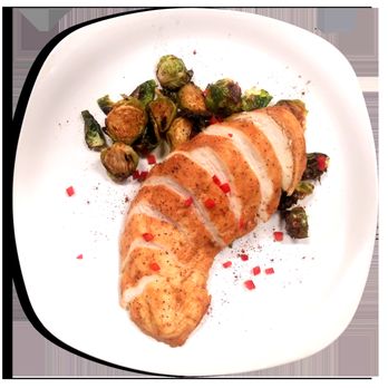 MenuBubble - a plate of food with chicken and brussels sprouts - Food Delivery Services Near Me