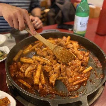Mapo Chicken - Stirring the chicken, rice cake, and sweet potato - Korean Near Me - Los Angeles, California