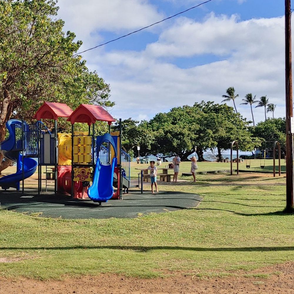 Such a great little park with picnic benches and play area for kids, including a public restroom