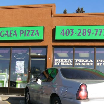 Pangaea Pizza - a silver car parked in front of a pizza parlor - Pizza Near Me - Calgary, Alberta Pangaea Pizza - a silver car parked in front of a pizza parlor - Pizza Near Me - Calgary, Alberta