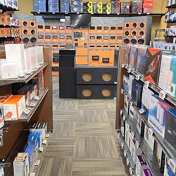 Electronic Express - Computer accessory aisle featuring cords, headphones, routers, portable storage, and more