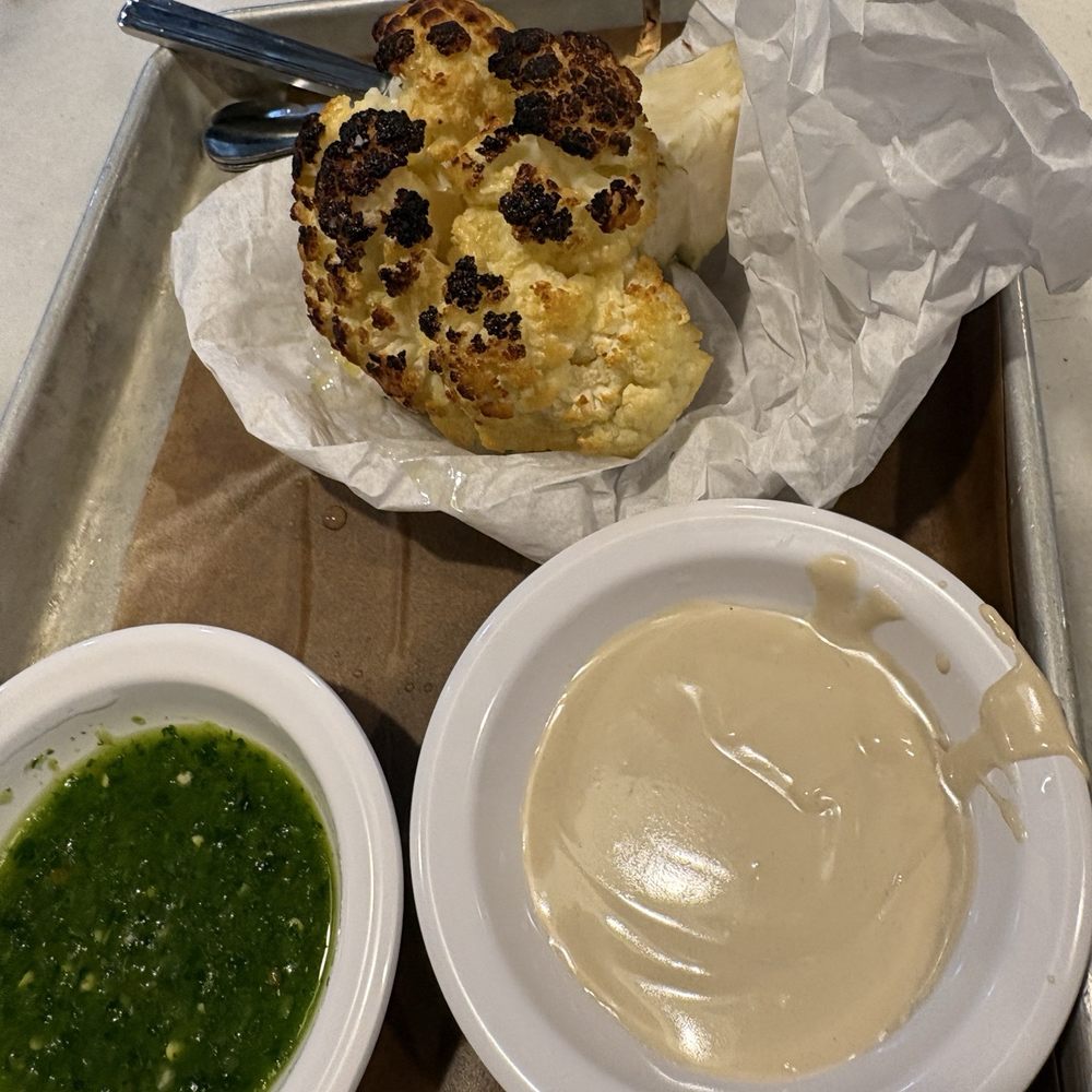 Miznon Kosher - Baby roasted Cauliflower with tahini and chug - must get - Mediterranean Near Me - New York, New York Miznon Kosher - Baby roasted Cauliflower with tahini and chug - must get - Mediterranean Near Me - New York, New York
