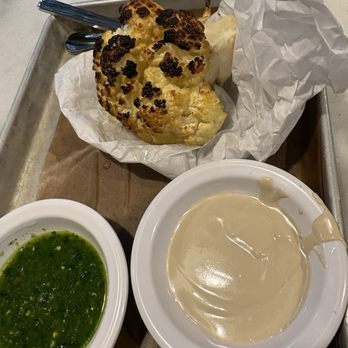 Miznon Kosher - Baby roasted Cauliflower with tahini and chug - must get - Mediterranean Near Me - New York, New York Miznon Kosher - Baby roasted Cauliflower with tahini and chug - must get - Mediterranean Near Me - New York, New York