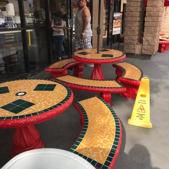 Tijuana tacos - Sitting area outside, there are about four tables. - Tacos Near Me - Pomona, California