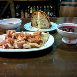 Orellas - Pig's ears and vino tinto served in a cunca.