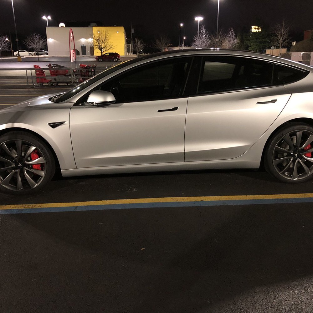 Satin silver vinyl wrap, chrome delete, 35% window tints and Gun Metal powder coated wheels on a Performance 3