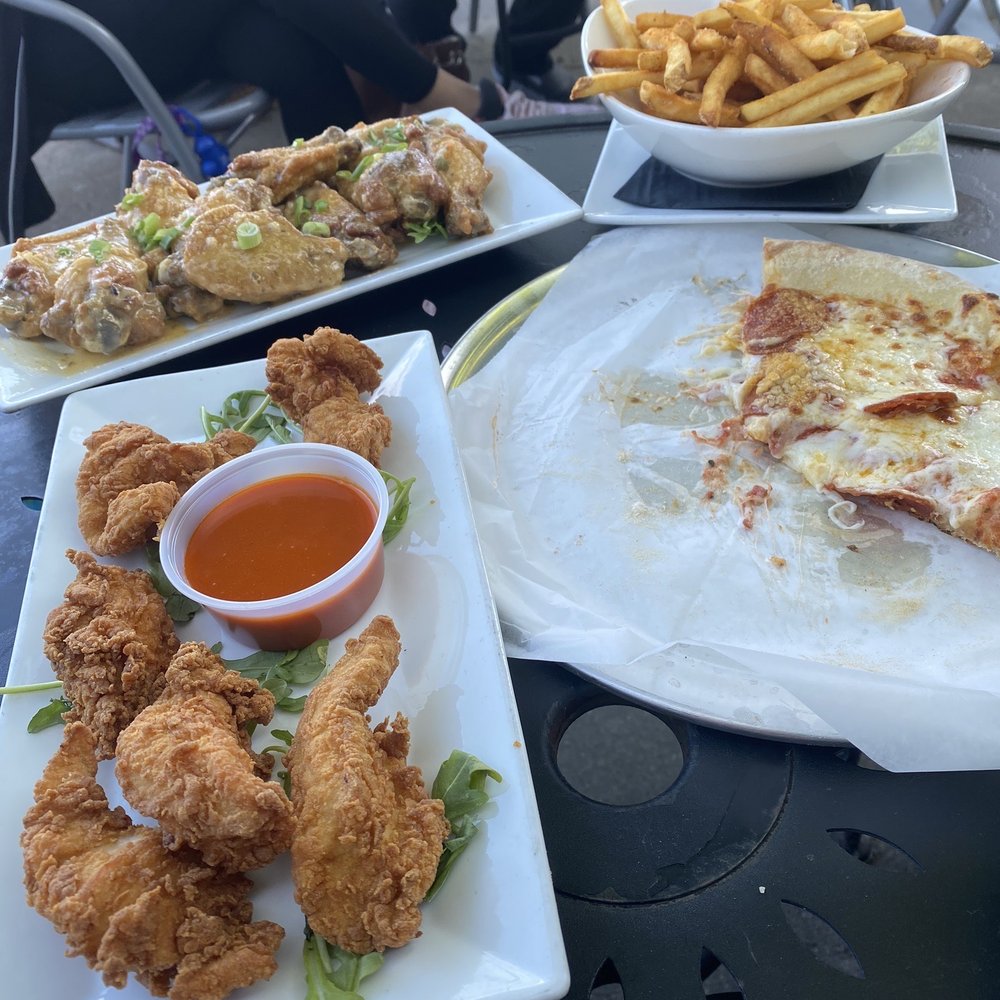 Flashback Retro Arcade + Bar + Grille - Chicken Tenders with a side of buffalo, Michelangelo pizza with pepperoni, Cajun fries, Garlic Parm wings - Bars Near Me - Hyannis, Massachusetts
