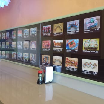 Yo Sushi - Here's the wall with sushi pictures and prices. - Sushi Bars Near Me - Albany, California