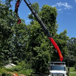 Godspeed Tree Service - This piece of equipment can top even the tallest trees.