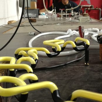 Neon Works - Joe Rizzo, owner, uses a vacuum machine to suck oxygen out, pump electricity, and adding a specific gas to attain a certain hue. - Metal Fabricators Near Me - Oakland, California