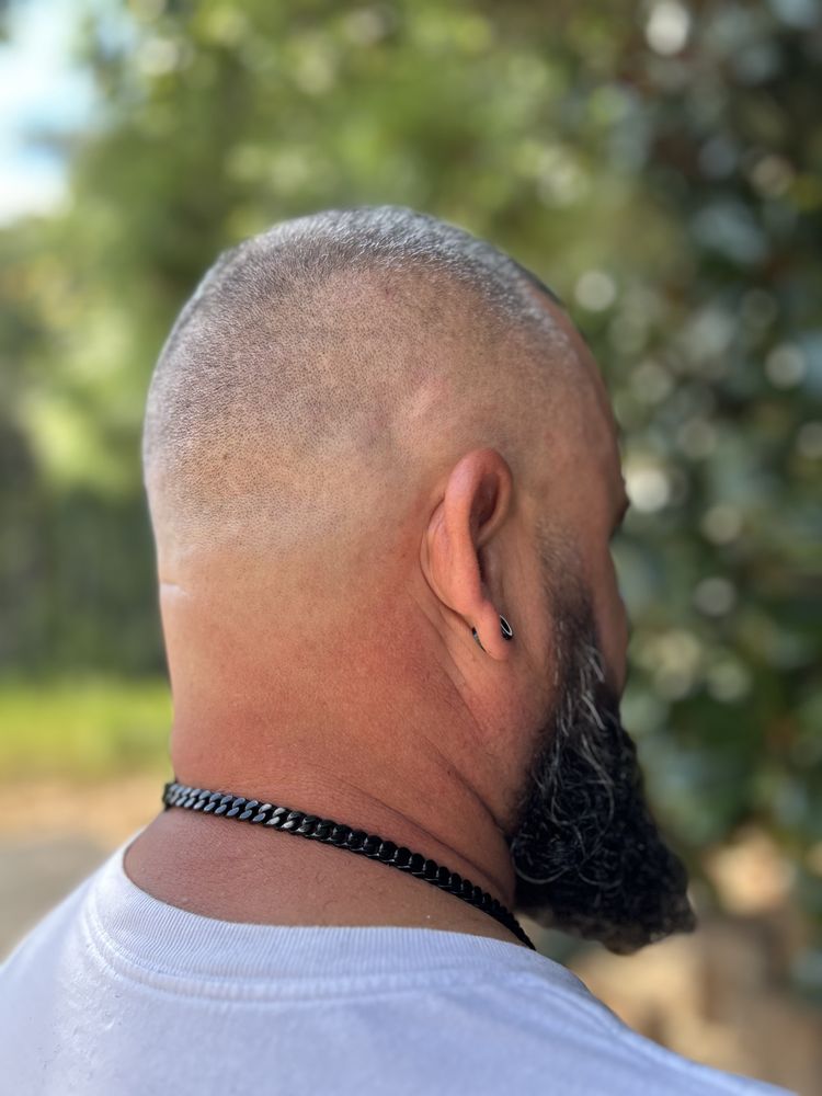 The Riveter Barbershop Logo