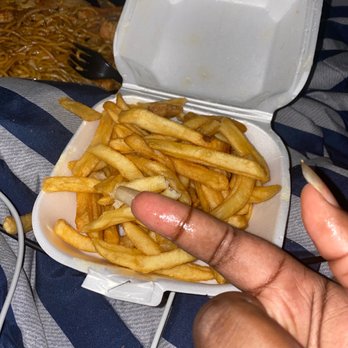 Great Wall Chinese Restaurant - a hand holding a container of french fries - Chinese Near Me - Folsom, Pennsylvania