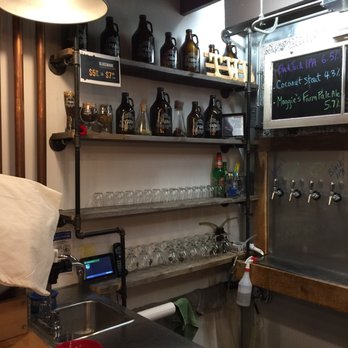 TWB - a bar with a lot of bottles on the shelves - Beer Tours Near Me - Kitchener, Ontario