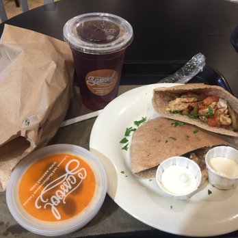 Sassool - Large chicken shawarma pita with a side of hummus and hot bread. - Mediterranean Near Me - Cary, North Carolina Sassool - Large chicken shawarma pita with a side of hummus and hot bread. - Mediterranean Near Me - Cary, North Carolina