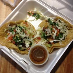 Antojitos Laredo - Soft tacos with everything and a side of delicious hot sauce.
